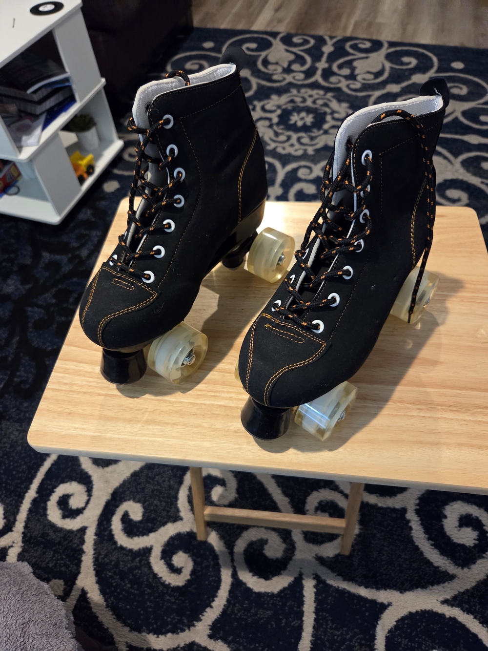 Black Roller Skate Boots with Orange Stitching and Clear Wheels